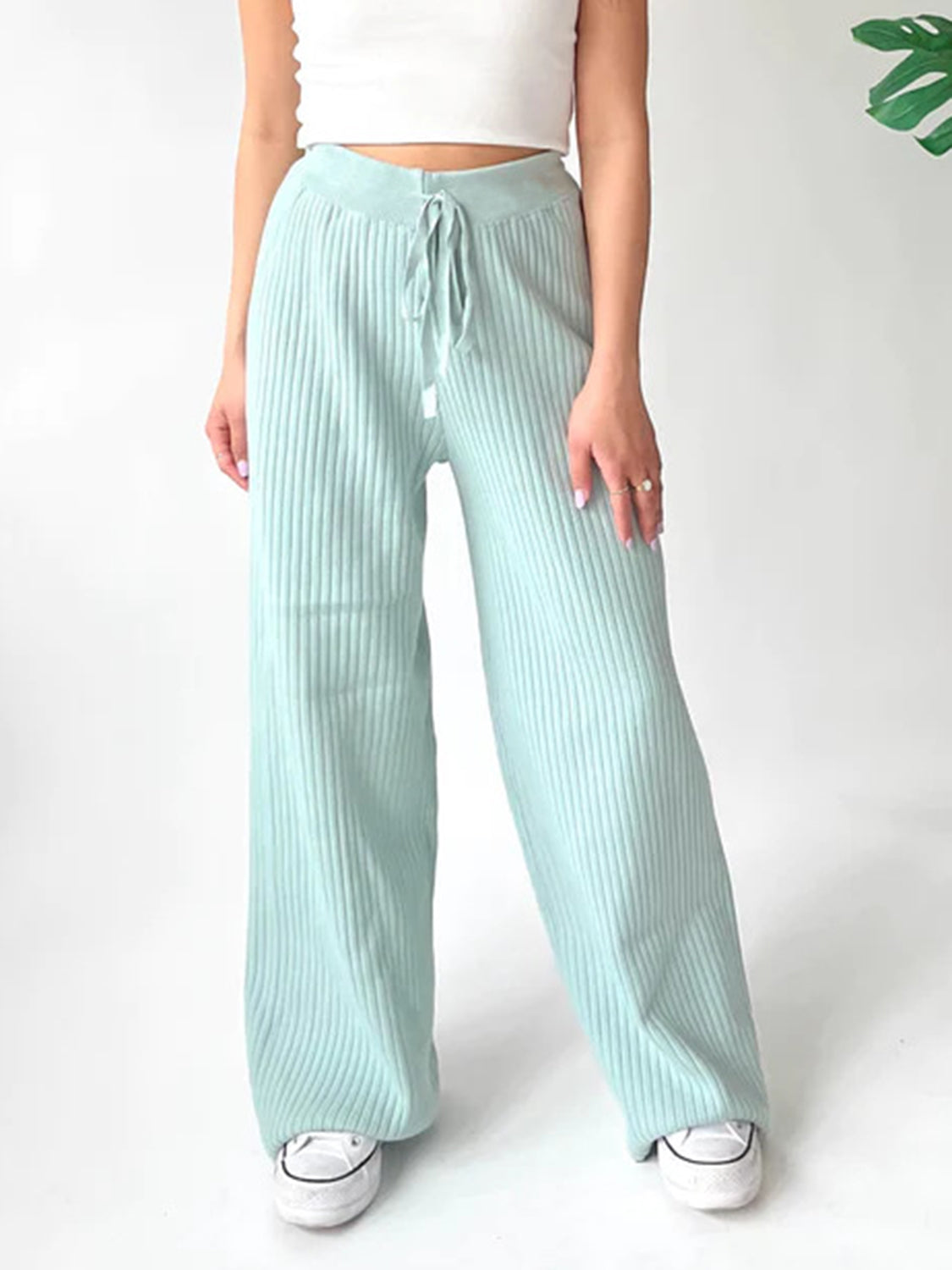 Mint blue ribbed knit palazzo trousers with drawstring waist and wide leg