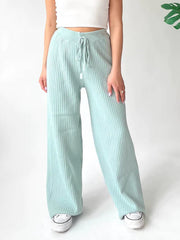 Mint blue ribbed knit palazzo trousers with drawstring waist and wide leg