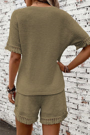 Army green waffle knit set with fringe trim on short sleeves and shorts.