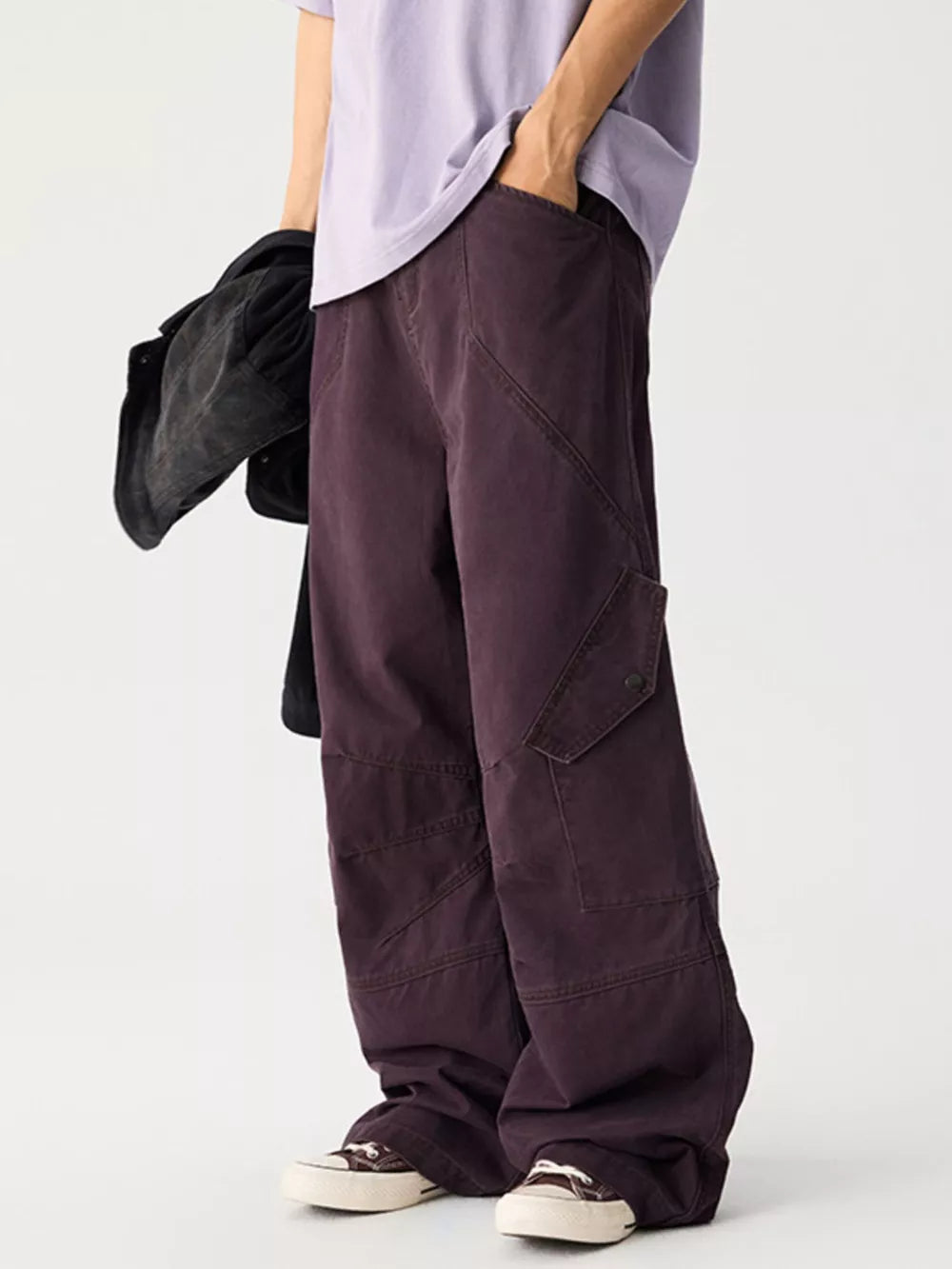 Relaxed fit cargo sweatpants in plum purple with multiple pockets and a button closure.