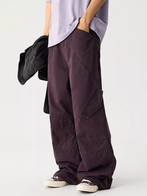Relaxed fit cargo sweatpants in plum purple with multiple pockets and a button closure.