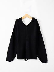 Black knit sweater with V-neck and lace-up detail at hem