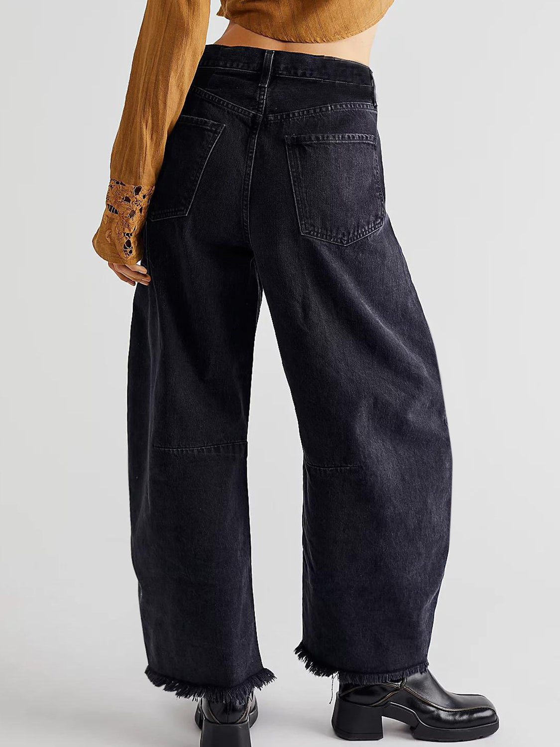 Black frayed hemline palazzo jeans with wide legs and a cropped fit.