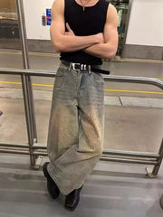 Vintage wash distressed wide-leg jeans in cotton with paint splatter details.