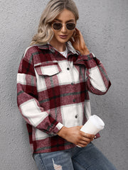 Burgundy plaid oversized button-up shirt with two chest pockets and button cuffs.
