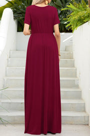Wine gathered waist maxi dress with short sleeves and pockets, flowing skirt.