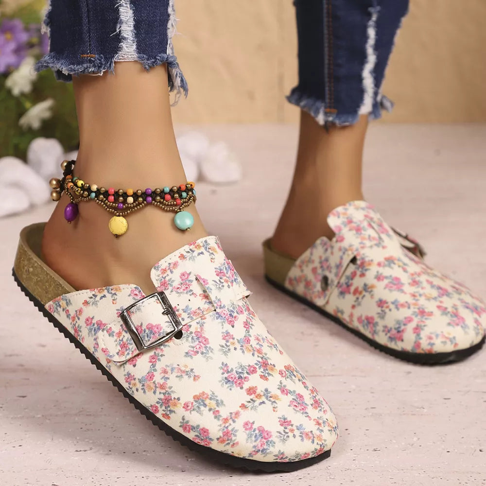 Floral print slip-on flats in beige with decorative buckle detail.