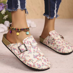 Floral print slip-on flats in beige with decorative buckle detail.
