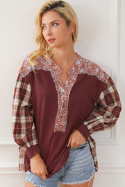 Burgundy mixed media blouse with floral yoke and plaid sleeves.