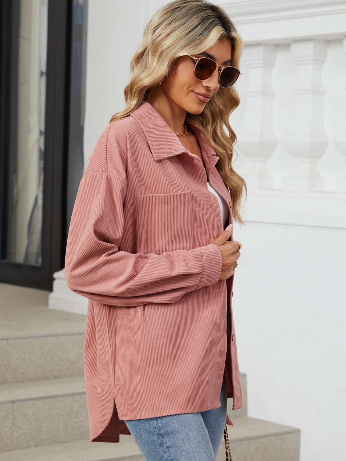 Pink corduroy overshirt with patch pockets and buttoned front.