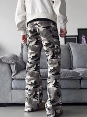 Camouflage utility wide-leg sweatpants with cargo pockets and a relaxed fit.