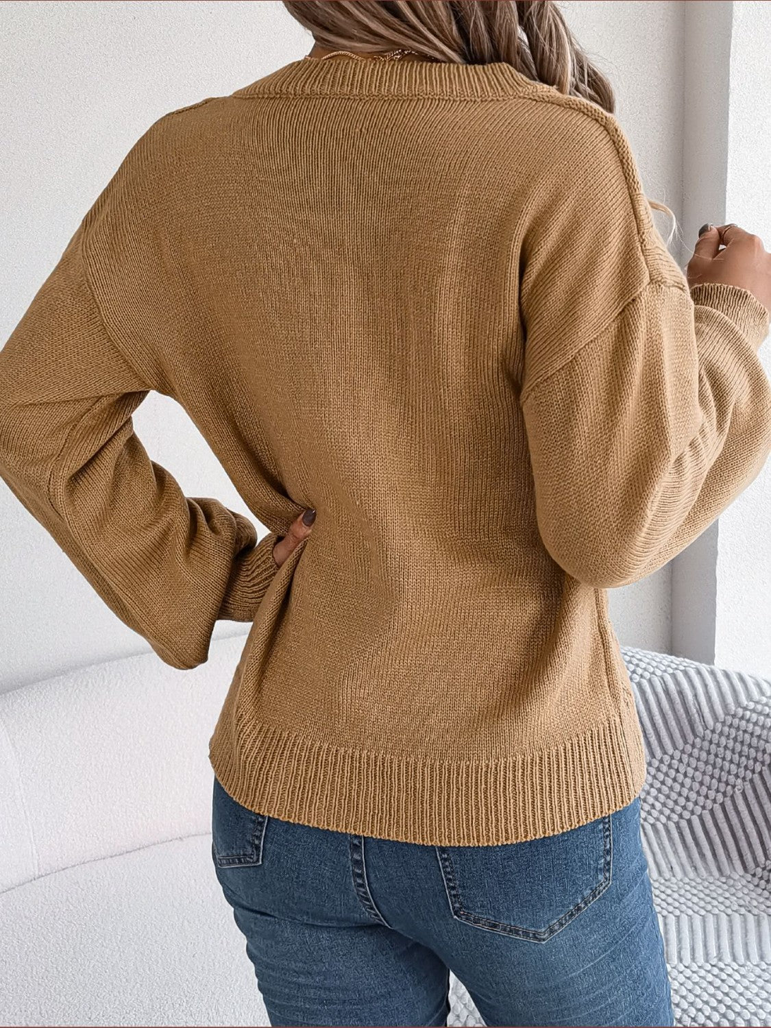 Cable knit button-front cardigan in khaki acrylic with ribbed hem and cuffs.