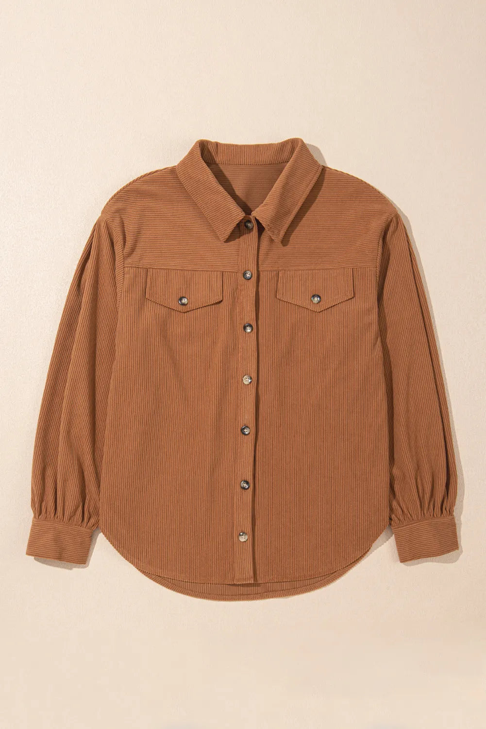 Caramel corduroy shirting jacket with gathered sleeves, button front, and chest pockets.