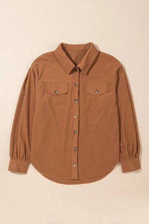 Caramel corduroy shirting jacket with gathered sleeves, button front, and chest pockets.