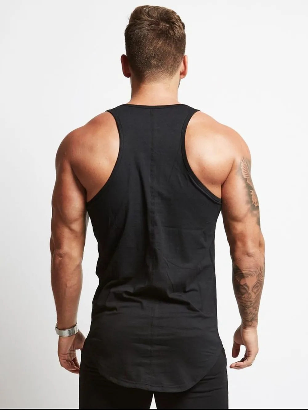 Black racerback tank top with roundneck, showing back view of muscular man.