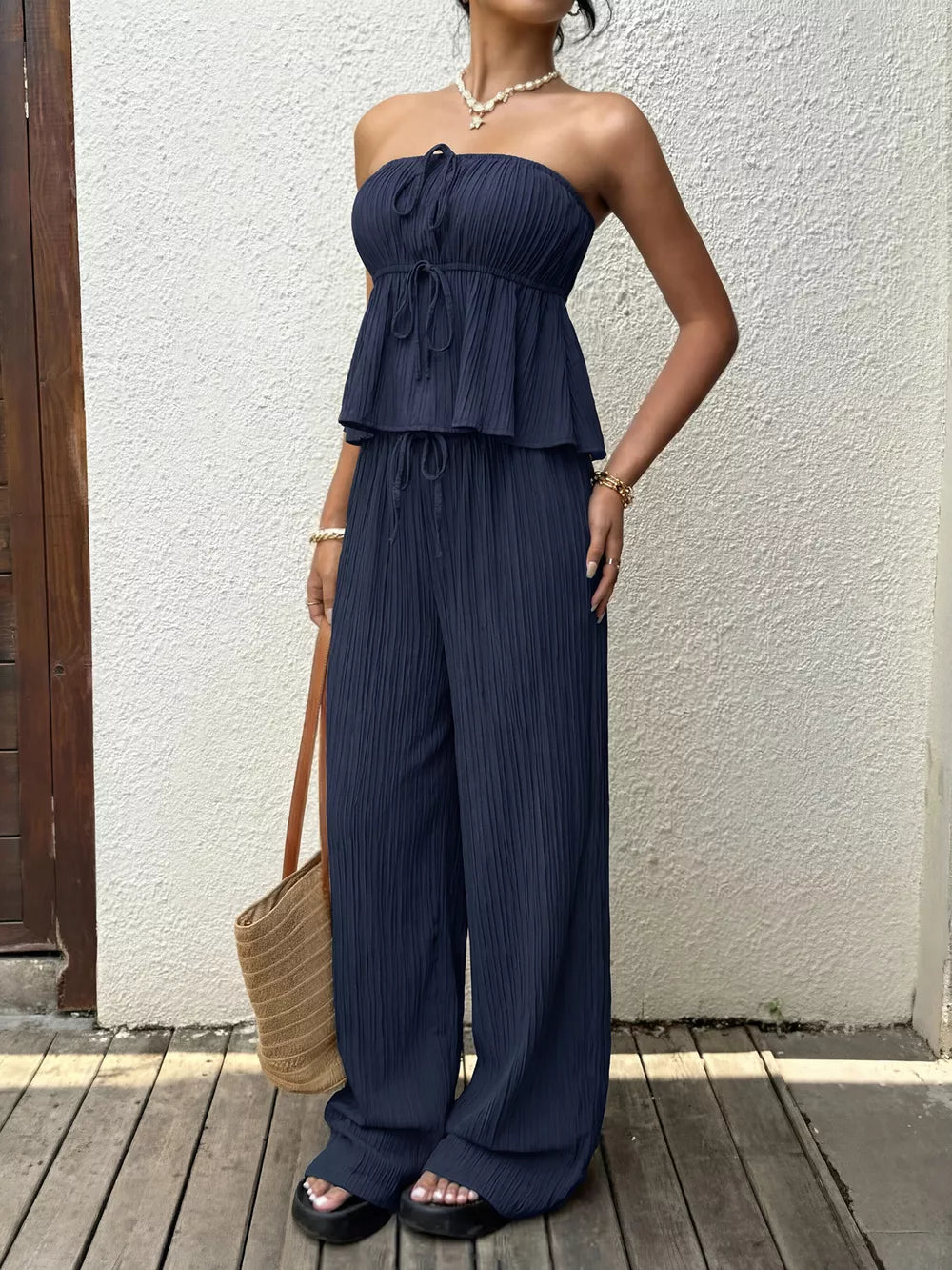 Navy ruffled peplum tube top and drawstring wide-leg pants set