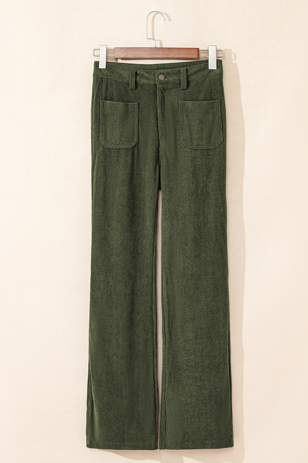Moss corduroy flared leg trousers with patch pockets and a button closure.