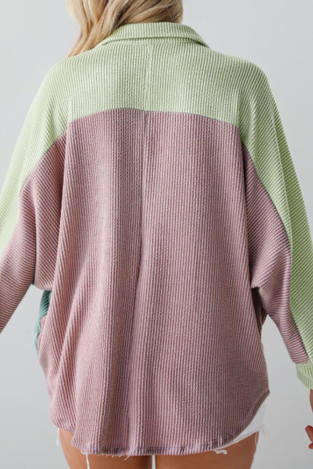 Waffle knit button-up shirt with colorblock design in dusty pink and light green.
