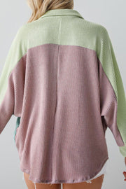 Waffle knit button-up shirt with colorblock design in dusty pink and light green.