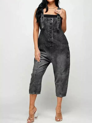 Black denim overalls with button-front and adjustable straps, cropped leg