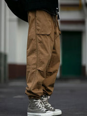 Men's caramel drawstring sweatpants with cargo pockets and elastic cuffs.