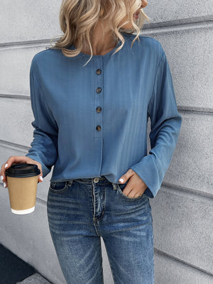 Dusty Blue Mandarin Collar Button-Down Blouse with subtle vertical texture and button front.