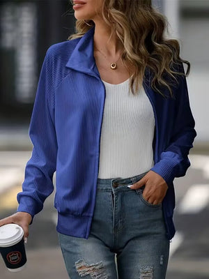 Textured ribbed raglan zip-up jacket in royal blue with a stand-up collar.