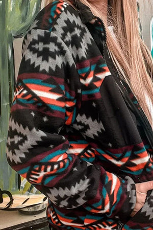 Black Aztec print fleece zip-up jacket with black panels and a zip closure.