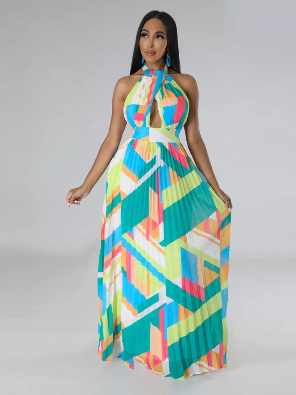 Halter neck maxi dress with geometric print, keyhole cutout, defined waistband, and pleated skirt.