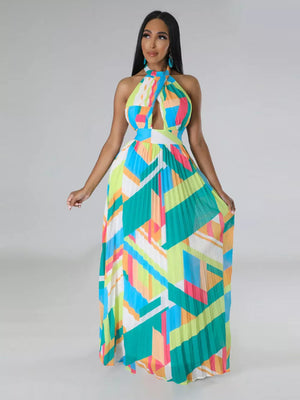Halter neck maxi dress with geometric print, keyhole cutout, defined waistband, and pleated skirt.