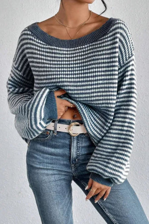 Off-shoulder blue and white striped knit pullover sweater with balloon sleeves.