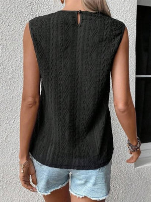 Black sleeveless blouse with textured geometric pattern and lace yoke detail.