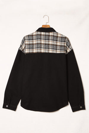Black denim trucker jacket with plaid panel on shoulders and back.