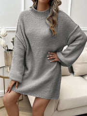 Gray knit mini dress with voluminous sleeves and mock neck.