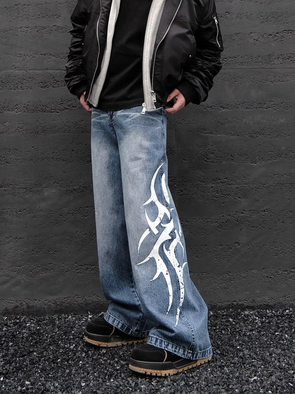 Men's blue denim wide leg jeans with tribal print detail