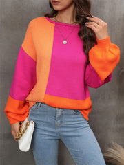 Colorblock knit sweater with balloon sleeves in hot pink and orange, crew neck, casual acrylic style.