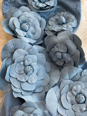 Blue denim strapless dress with 3D floral applique embellishments.