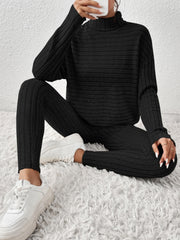 Black ribbed turtleneck loungewear set with high-waisted leggings and long sleeves.