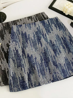Shimmering sequin mini skirt in dark blue with vertical stripe pattern.