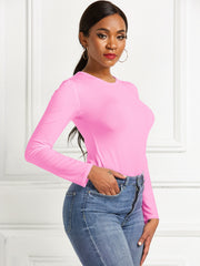 Pink long sleeve ribbed bodysuit with crew neck, body-hugging fit