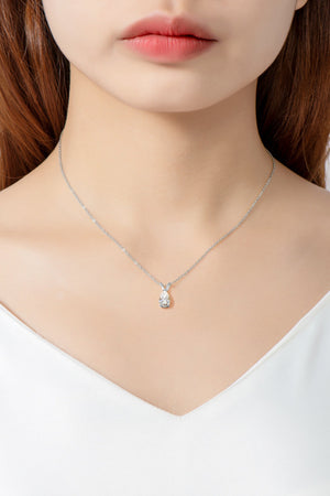 Silver pear cut moissanite pendant necklace with delicate chain.