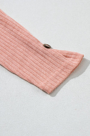 Dusty pink ribbed knit henley top sleeve detail with button