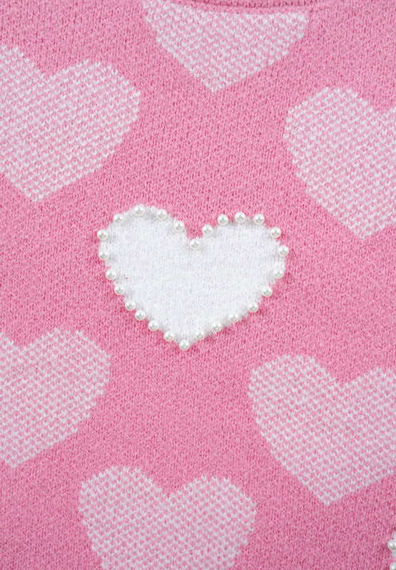 Pink knit sweater with white intarsia hearts and pearl-embellished heart detail.