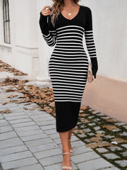 Black and white striped knit midi dress with V-neck and long sleeves.