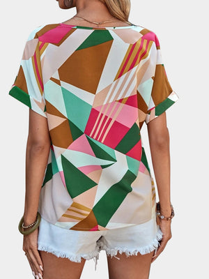 Geometric print V-neck blouse with short sleeves in multicolor.