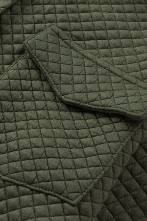 Army green quilted overshirt with diamond pattern and patch pockets.