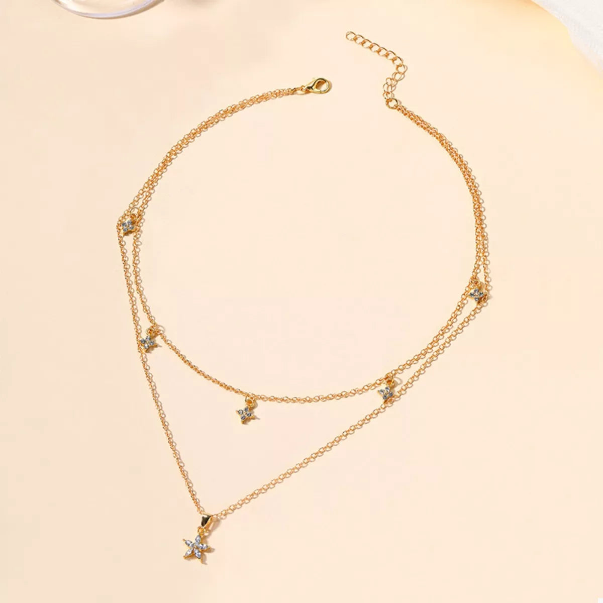 Gold double layer necklace with star charms and clear crystals
