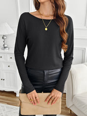 Black ribbed knit long sleeve top with boat neck, styled with leather pants and clutch.