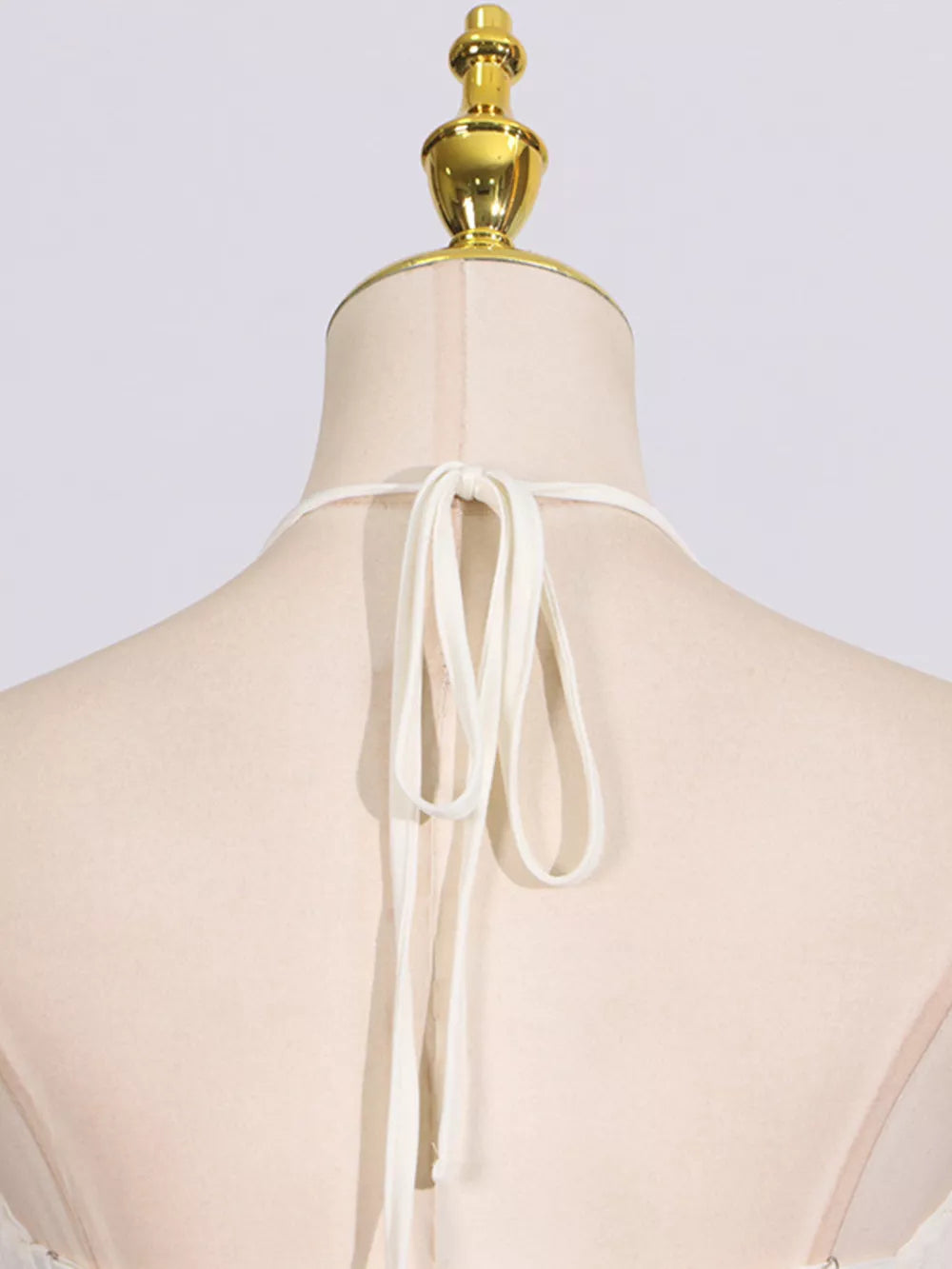Textured halter neck maxi gown with tie closure detail