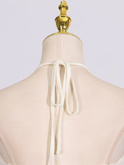 Textured halter neck maxi gown with tie closure detail